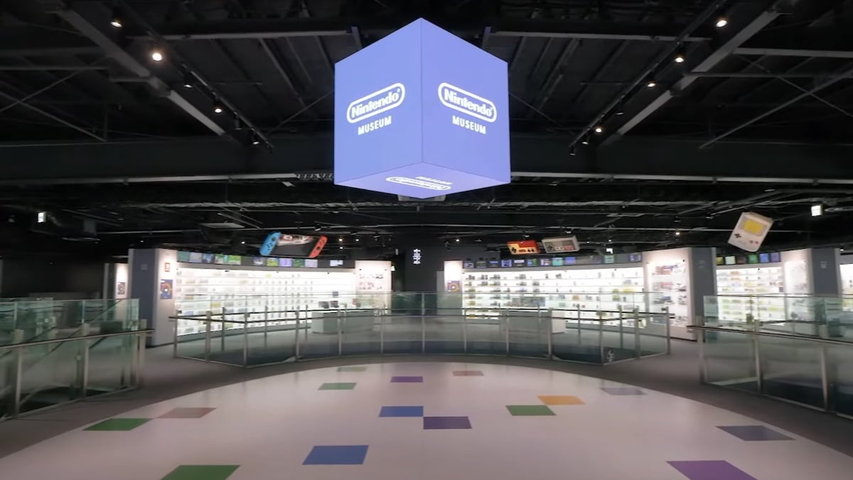 An image from the main floor of the Nintendo Museum. This features a large central area that displays old video games in white cases.